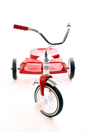 Klassisk röd trehjuling